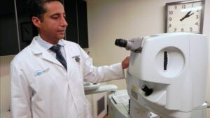 Dr Martinez with diagnostic eye care machine