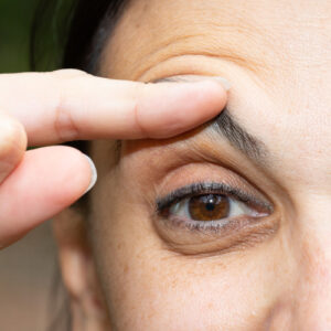 Woman lifting up her eyebrow