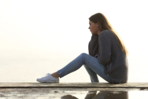 woman sitting on ledge