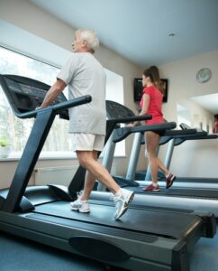 Man and woman on treadmill 