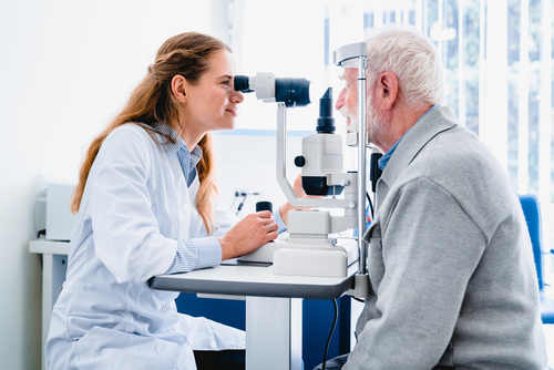 Doctor examining patients eyes