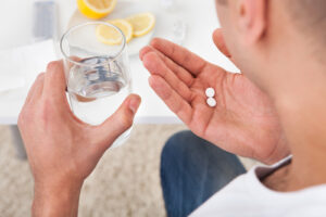 man taking medications