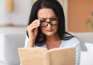 woman reading with glasses