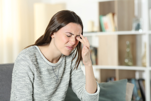 Woman with irritated dry eyes