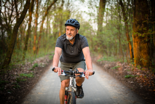 Senior man on a mountain bike